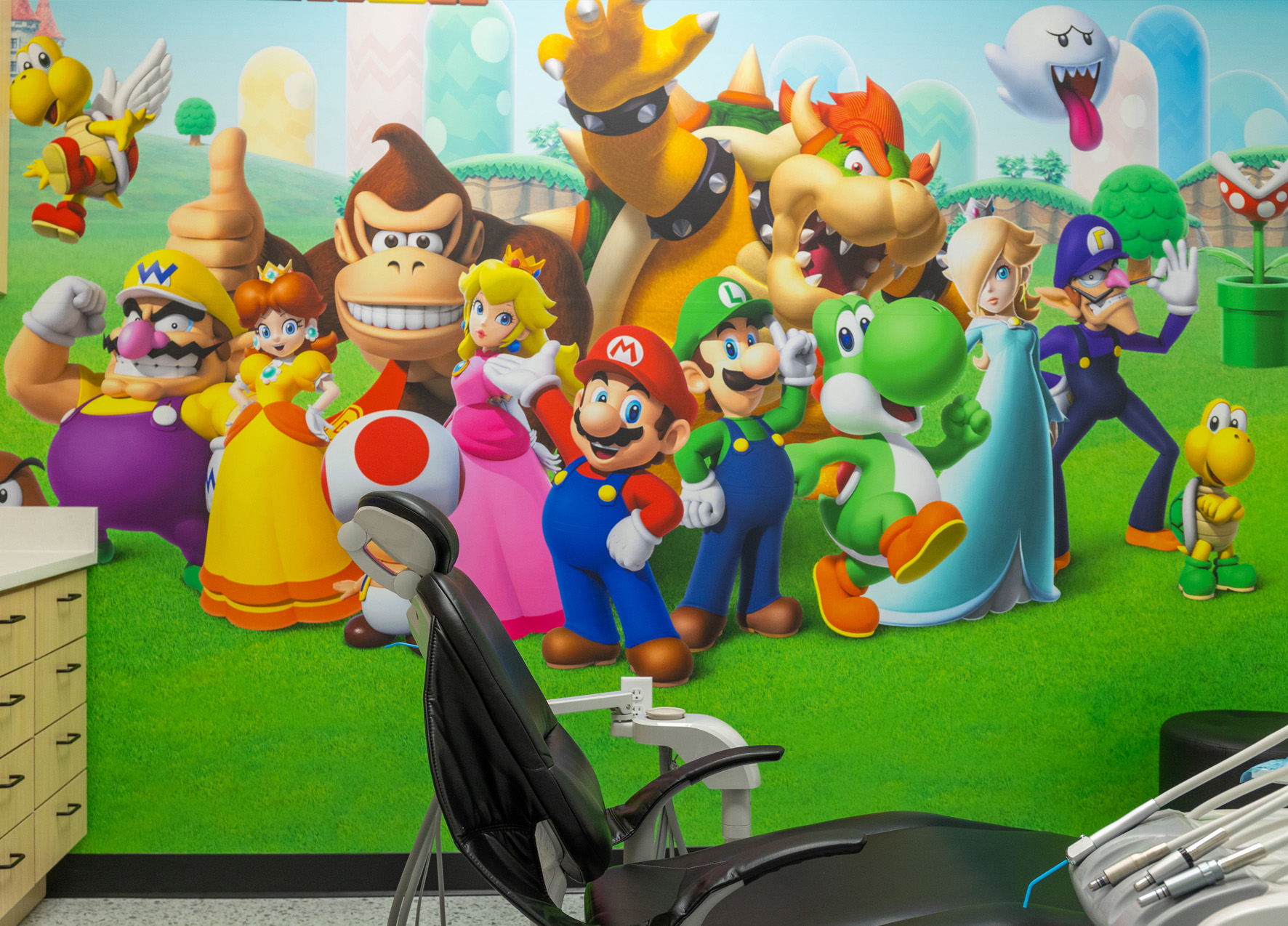 Dental treatment room with Mario characters painted on the wall