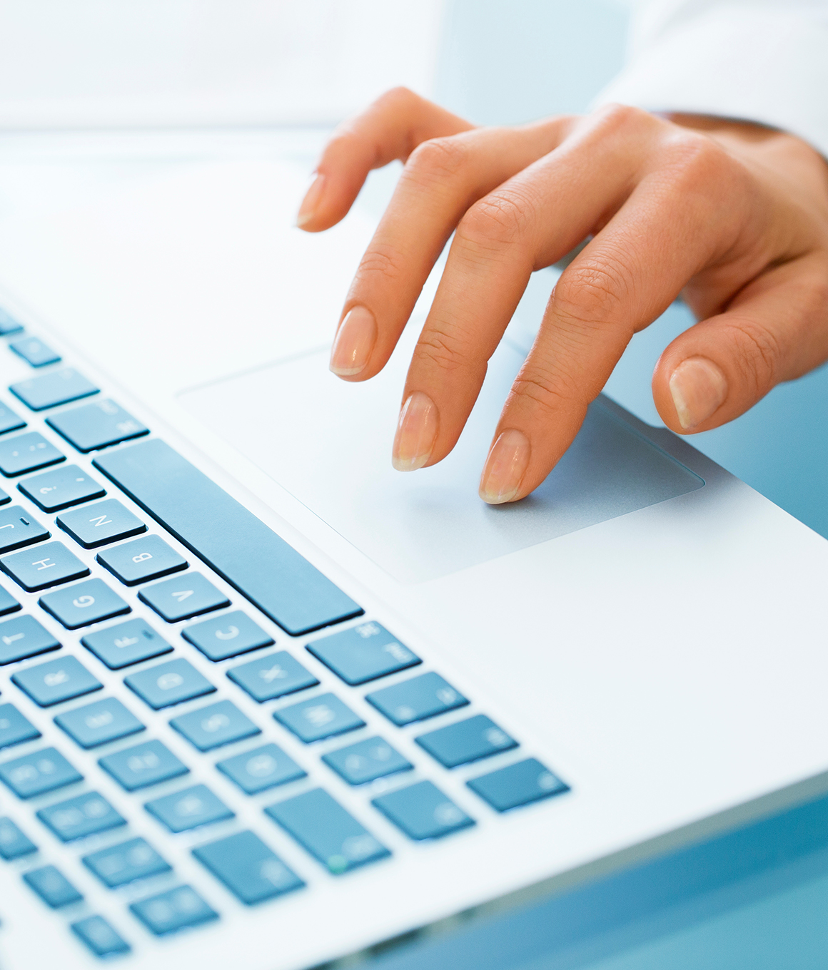 Person using the track pad on a laptop