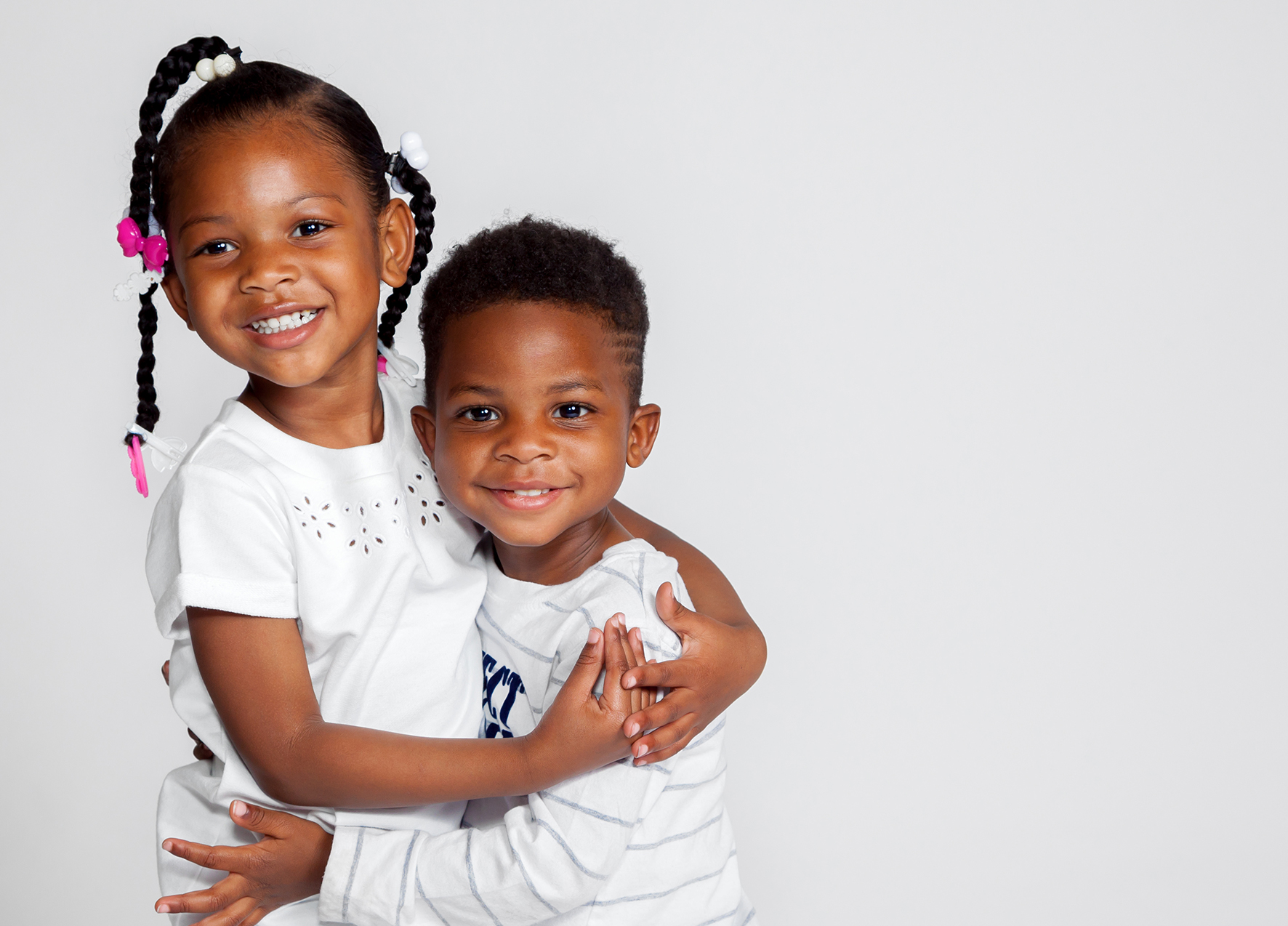 Brother and sister hugging after visiting childrens dentist in Murphy