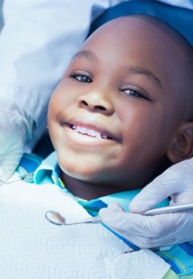 Child smiling at dental checkup