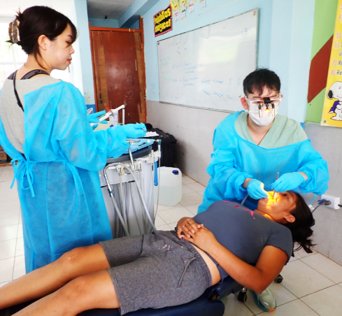 Dentist showing a patient x rays of their teeth