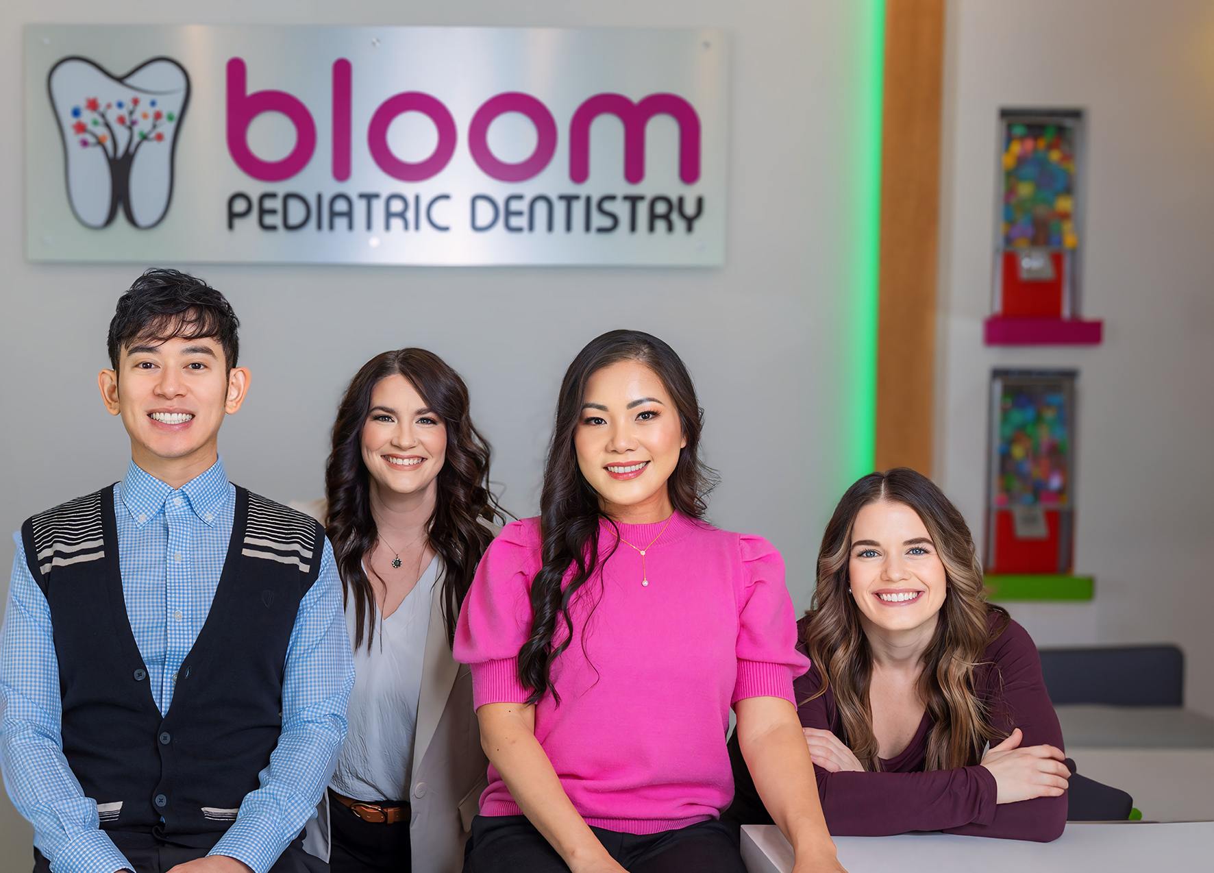 Four smiling pediatric dental team members at Bloom Pediatric Dentistry in Murphy