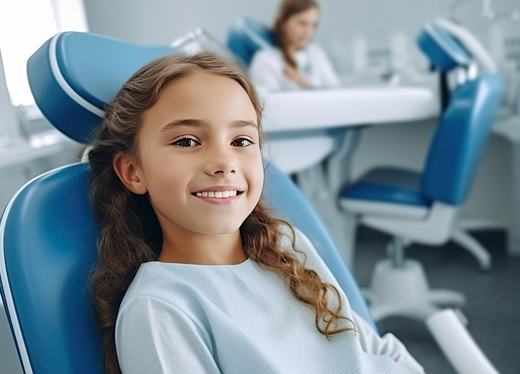 Girl smiling in dental chair after receiving minimally invasive dentistry in Murphy