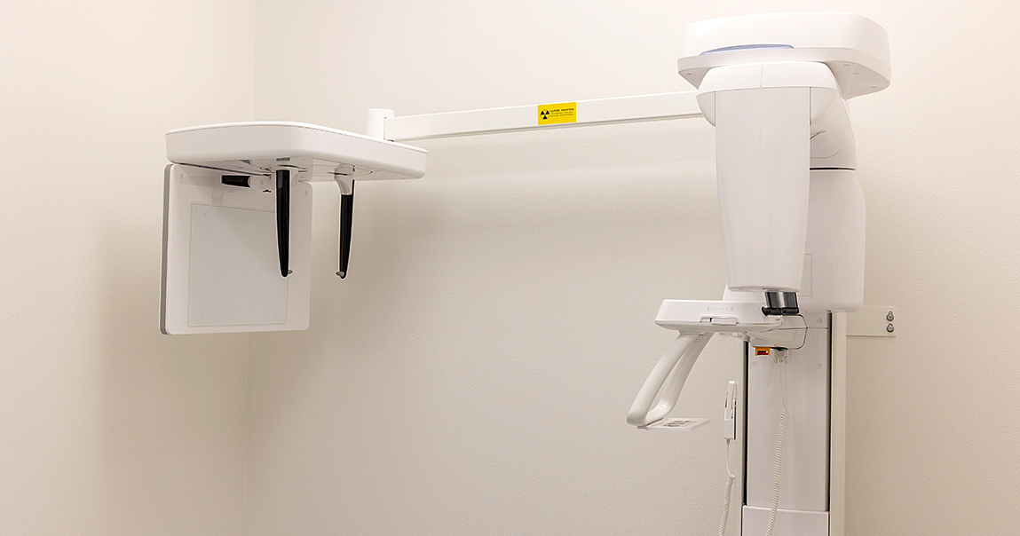 Dental scanning machine standing against white wall