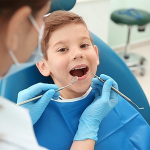 Child smiling at dental checkup