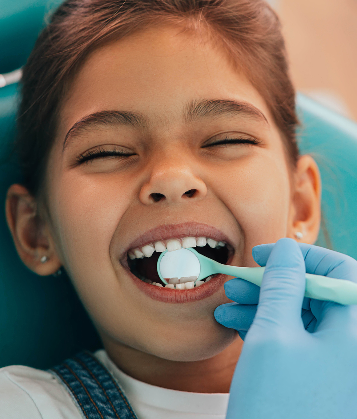 Young girl receiving a dental checkup