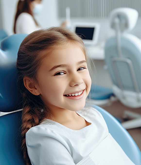 Girl smiling in dental chair